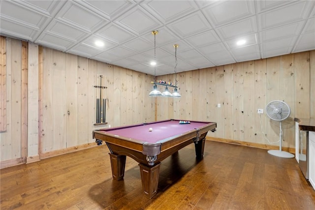 recreation room featuring wood walls, hardwood / wood-style floors, and pool table