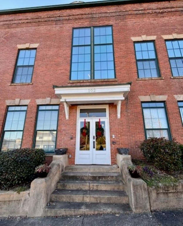 property entrance featuring french doors