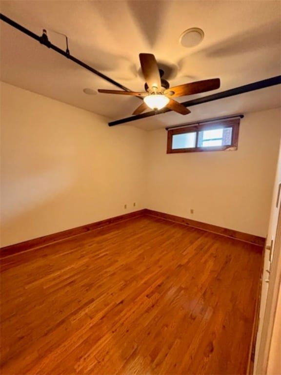 empty room featuring wood-type flooring