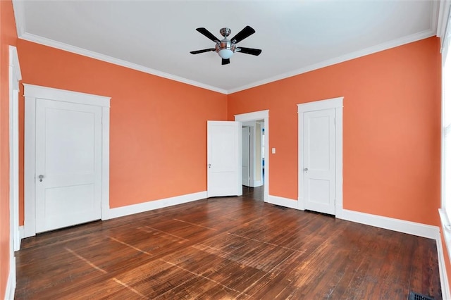 unfurnished bedroom with ceiling fan, dark wood-type flooring, and ornamental molding