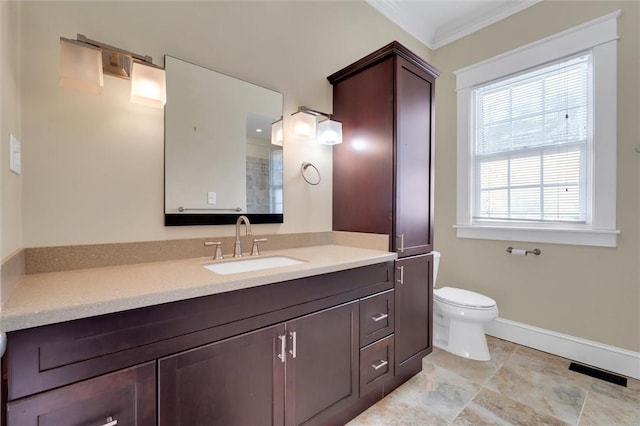 bathroom with vanity, toilet, and crown molding