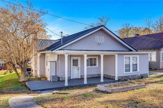 bungalow-style home featuring a front lawn