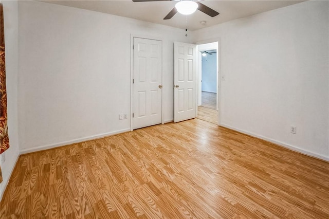 unfurnished bedroom featuring ceiling fan and light hardwood / wood-style floors