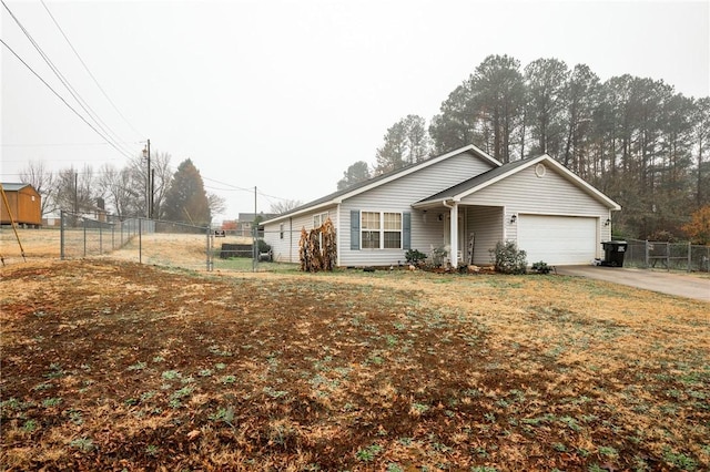 ranch-style house with a garage and a front lawn