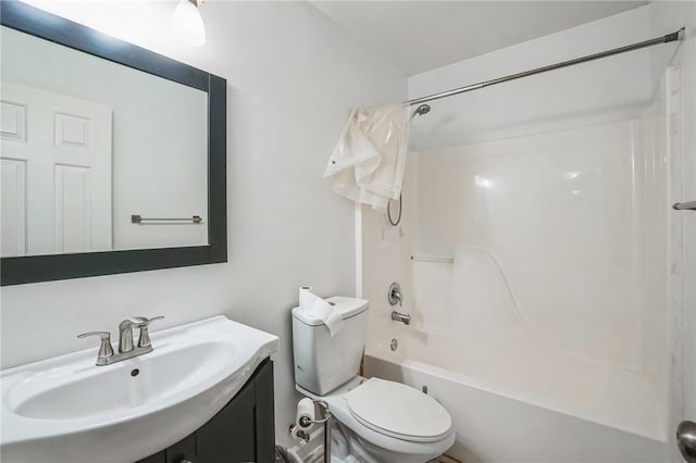 full bathroom with sink,  shower combination, and toilet