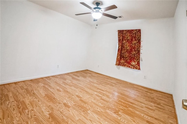 unfurnished room with light wood-type flooring