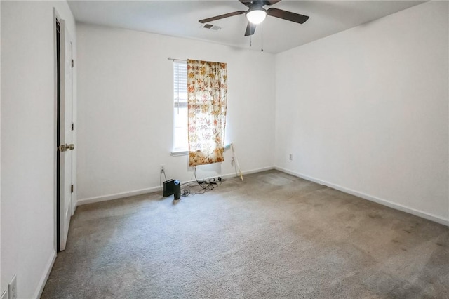 carpeted empty room featuring ceiling fan