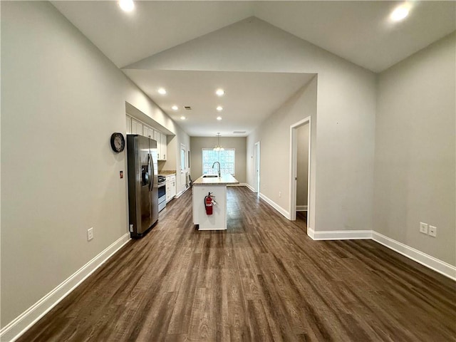 rec room with vaulted ceiling, sink, dark hardwood / wood-style floors, and an inviting chandelier