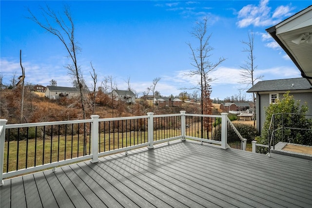 wooden deck with a lawn