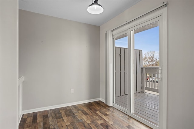 unfurnished room featuring dark hardwood / wood-style flooring