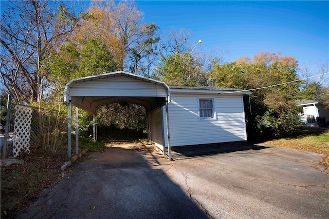 view of outbuilding featuring a carport