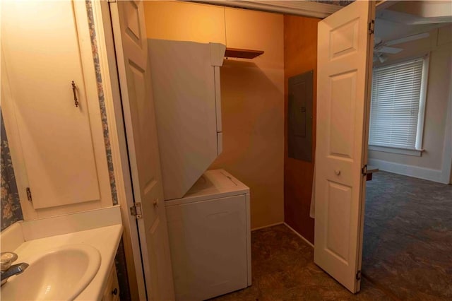 102 Wardlaw St, Abbeville, SC 29620 - bathroom featuring stacked washer and dryer, baseboards, electric panel, and vanity
