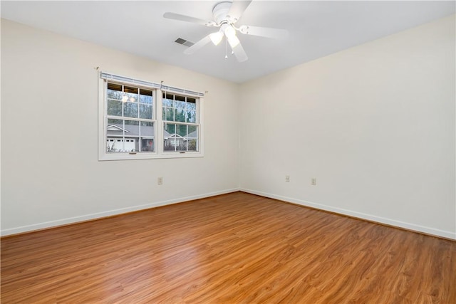 spare room featuring ceiling fan and light wood-type flooring