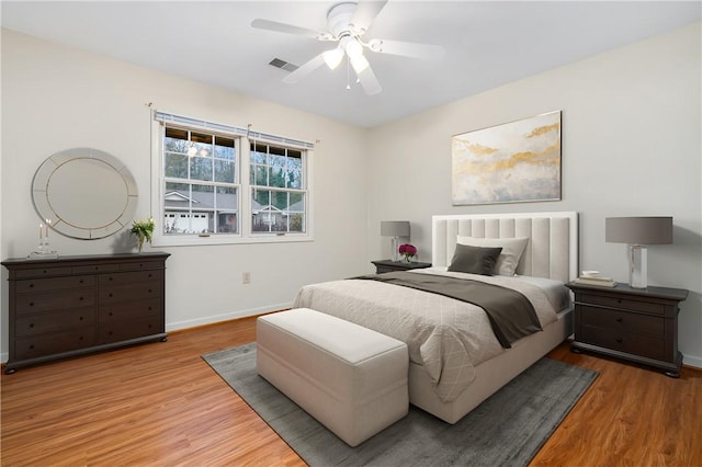 bedroom featuring ceiling fan and light hardwood / wood-style flooring