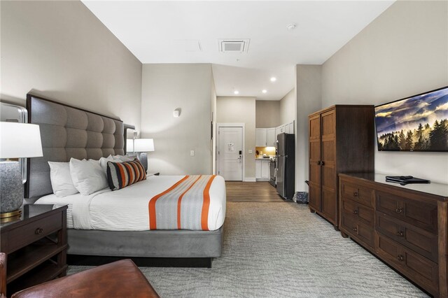 13500 Clemson Blvd Unit 2108, Seneca, SC 29678 - bedroom featuring stainless steel fridge and light wood-type flooring