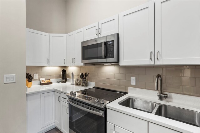 13500 Clemson Blvd Unit 2108, Seneca, SC 29678 - kitchen featuring decorative backsplash, white cabinetry, sink, and appliances with stainless steel finishes
