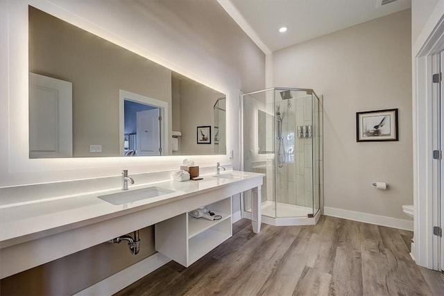 bathroom with walk in shower, vaulted ceiling, toilet, vanity, and hardwood / wood-style flooring