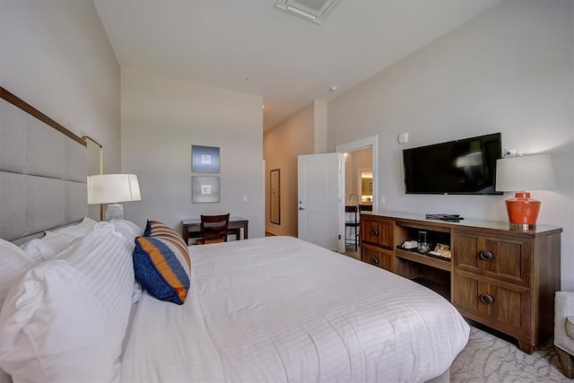 carpeted bedroom featuring lofted ceiling