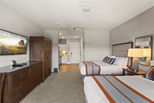 bedroom with wood-type flooring