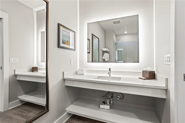 bathroom with wood-type flooring and vanity