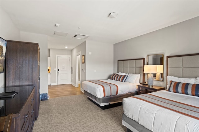 bedroom with light hardwood / wood-style flooring