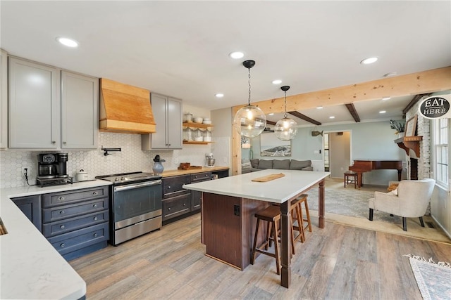 kitchen with premium range hood, gray cabinetry, light hardwood / wood-style flooring, and stainless steel electric range