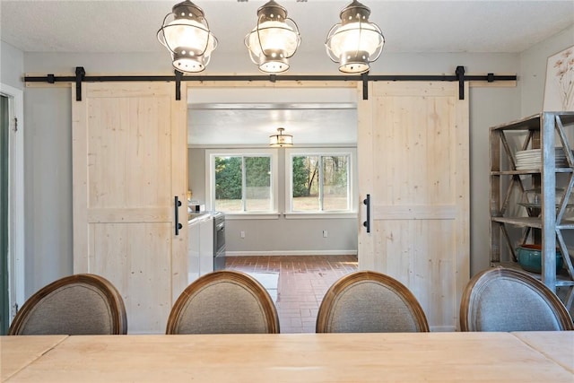 dining space with a barn door