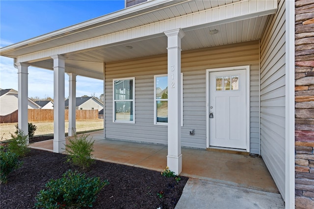 property entrance featuring covered porch