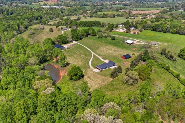 drone / aerial view with a rural view and a water view