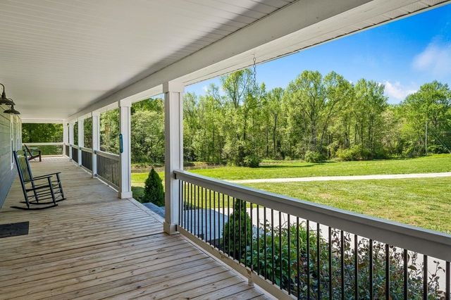 wooden deck featuring covered porch