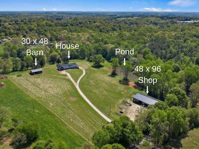 birds eye view of property with a rural view