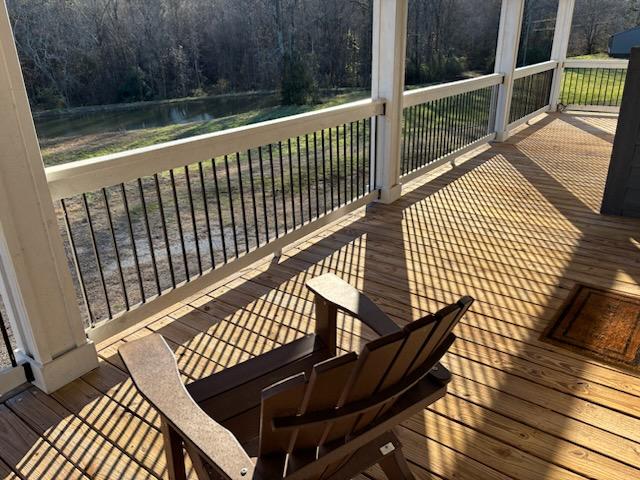 wooden terrace with a water view