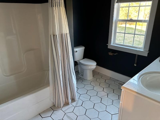 full bathroom with tile patterned flooring, vanity, toilet, and shower / tub combo with curtain