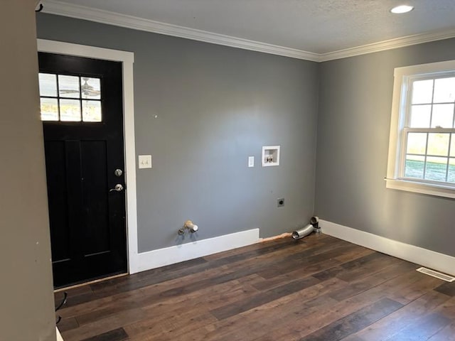 clothes washing area featuring hookup for a washing machine, dark hardwood / wood-style flooring, electric dryer hookup, crown molding, and hookup for a gas dryer