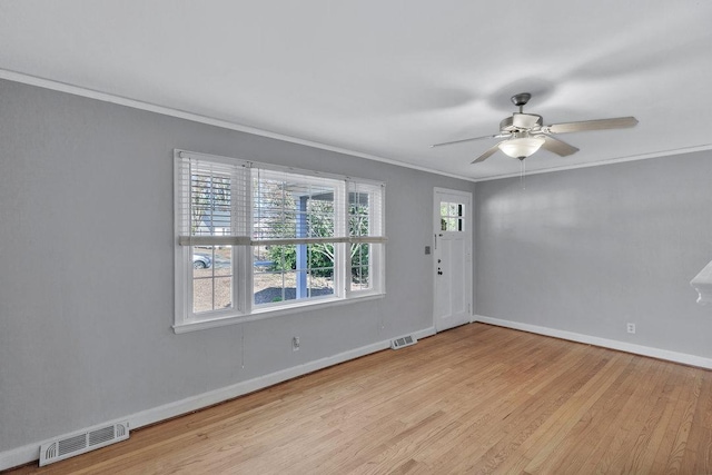 unfurnished room featuring ceiling fan, light hardwood / wood-style flooring, and ornamental molding