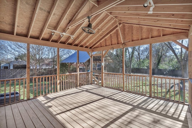 unfurnished sunroom with vaulted ceiling