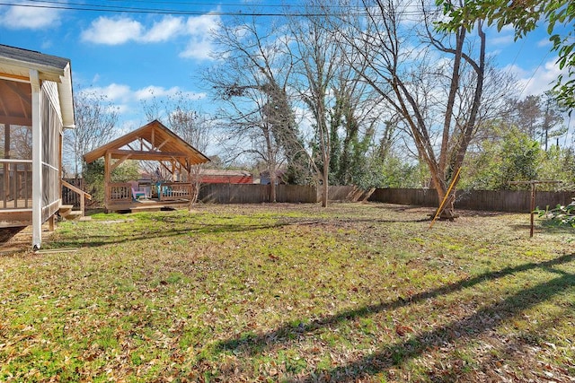 view of yard featuring a wooden deck and a gazebo