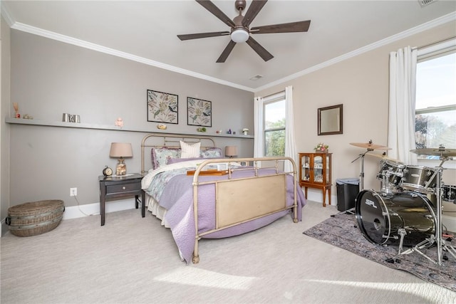 bedroom featuring carpet, ceiling fan, and crown molding