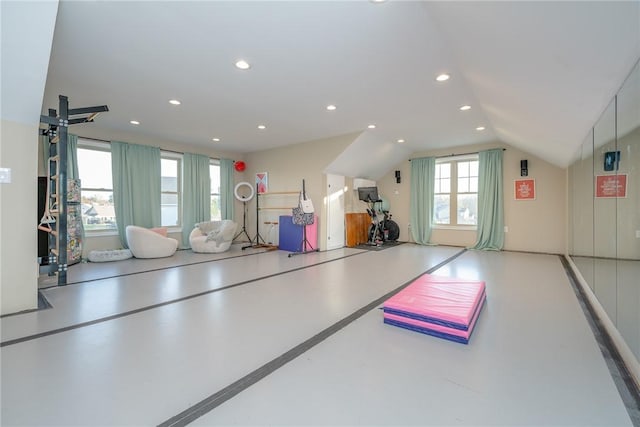 workout room featuring vaulted ceiling