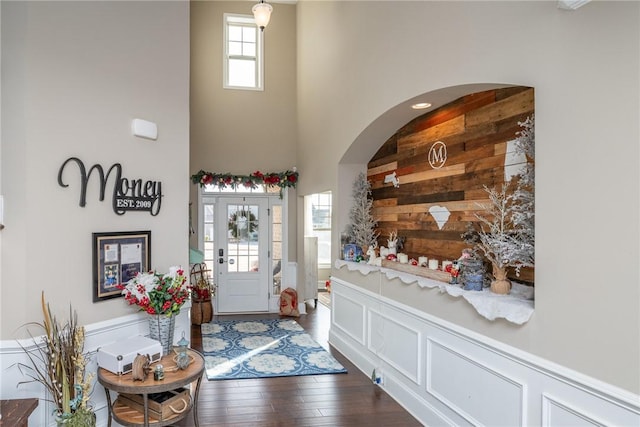 foyer featuring a high ceiling and dark hardwood / wood-style floors