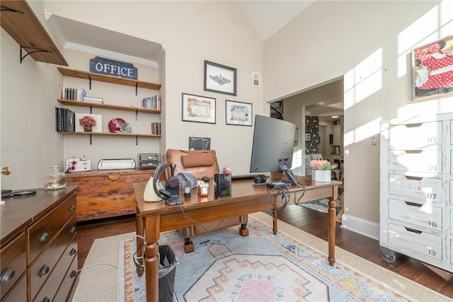 office with crown molding, dark wood-type flooring, and high vaulted ceiling