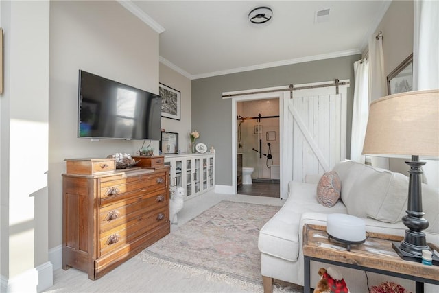 living room featuring a barn door and ornamental molding