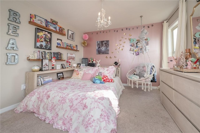 carpeted bedroom featuring a notable chandelier