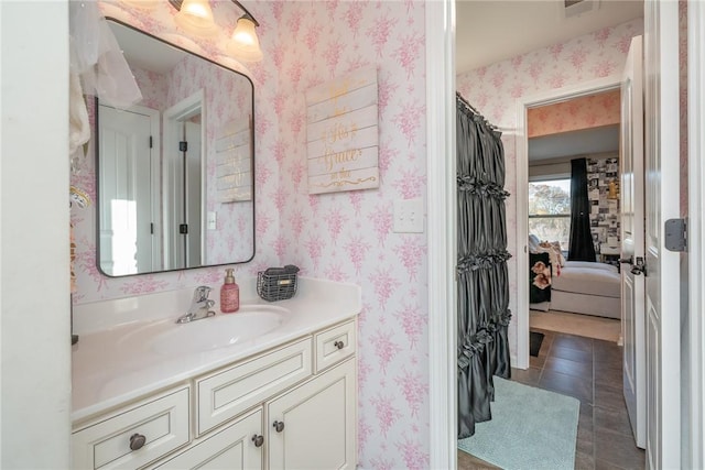 bathroom with tile patterned flooring and vanity