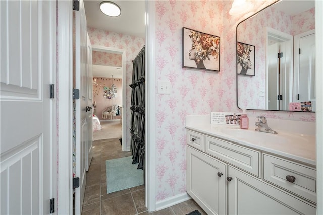 bathroom featuring tile patterned flooring and vanity