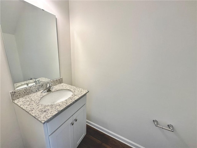 bathroom featuring vanity and hardwood / wood-style flooring