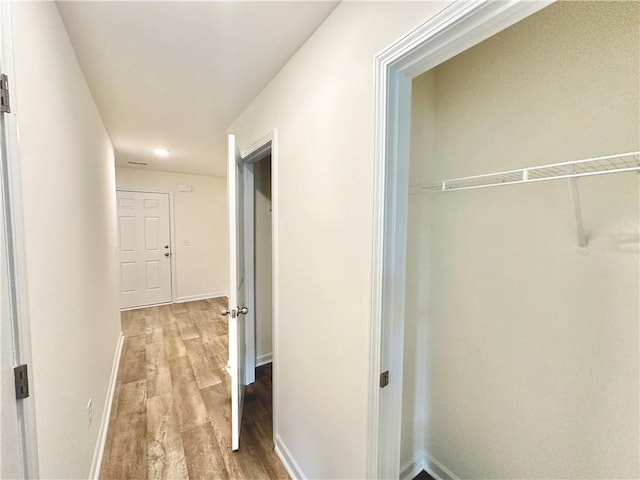 hallway featuring hardwood / wood-style floors