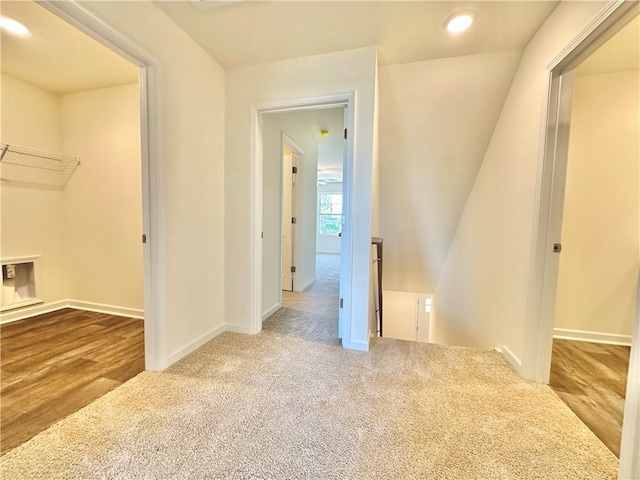 hallway featuring carpet