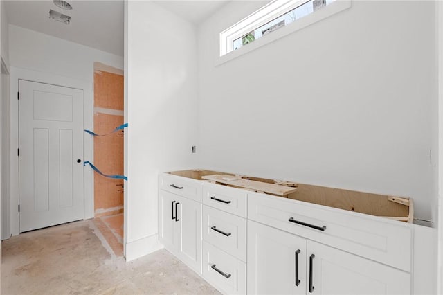 bathroom with concrete flooring