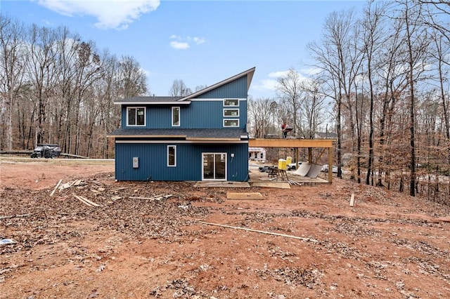 back of property with a patio